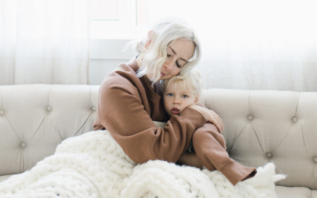 Meagan cuddled on the couch using visualization to achieve her dream life