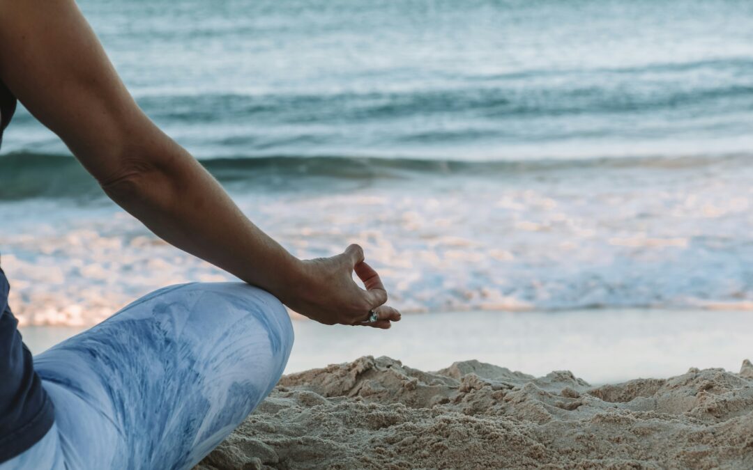 Woman doing a self hypnosis on the beach to transform her life Focus Keywords: Transform your life